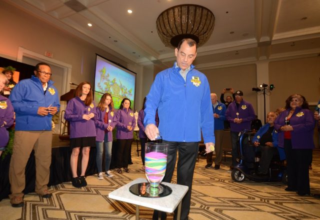 Colorado kidney recipient Jeff Leone takes part in a sand pouring ceremony