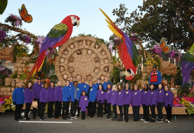 People whose lives have been affected by organ, eye and tissue donation line up in front of the 2018 Donate Life Rose Bowl Parade float