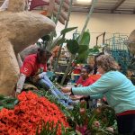 Colleen Reed decorates Donate Life Rose Parade float